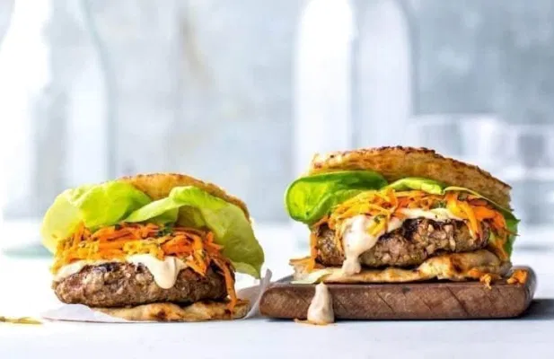 Spicy Burgers With Tahini Sauce and Harissa Carrot Slaw - FoodWage recipe